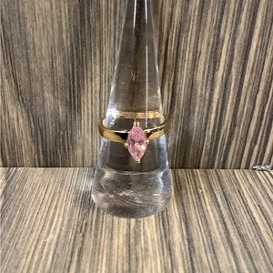 Gold tone ring with pink stone